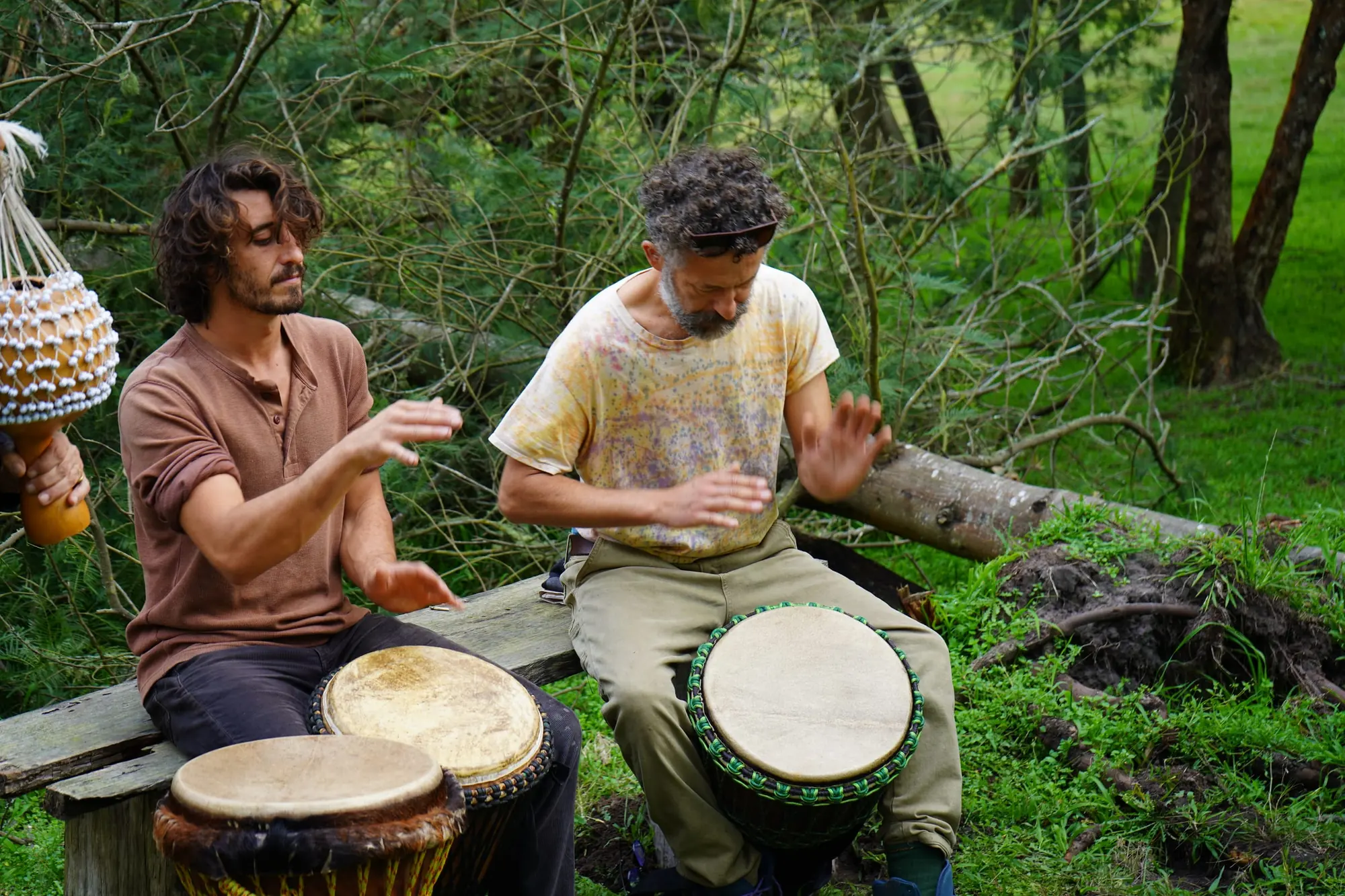 A group listening to a briefing on the hillside before planting